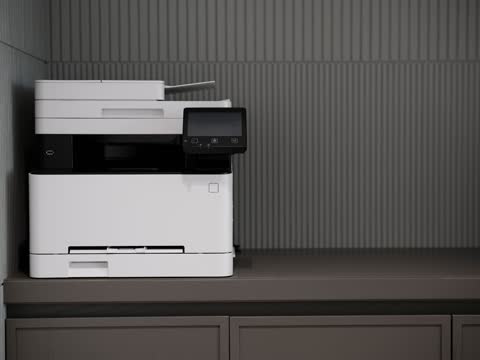 Colour laser multifunction printer on an office cabinet