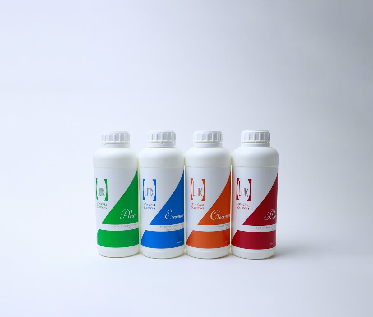 Four refill ink bottles with colour-coded labels