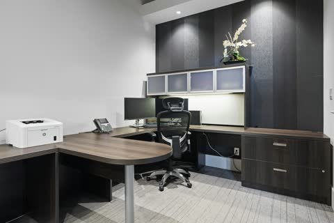 Modern home office with a small white printer on the desk