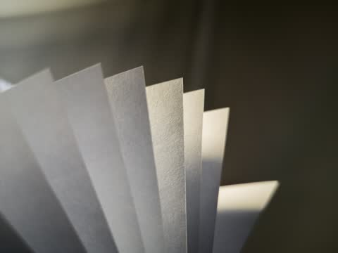 Sheets of white paper fanned out