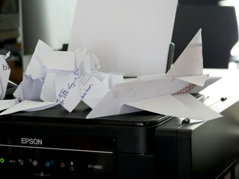 Crumpled paper stuck in the output tray of an Epson printer