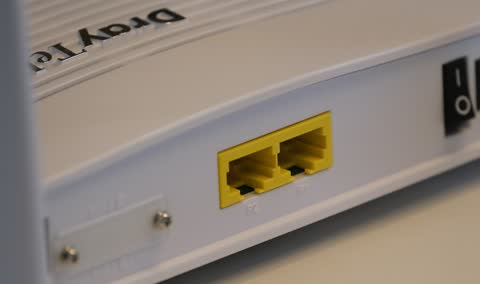 Ethernet ports on the side of a white router