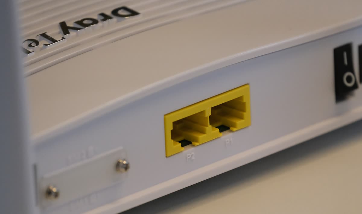 Ethernet ports on the side of a white router