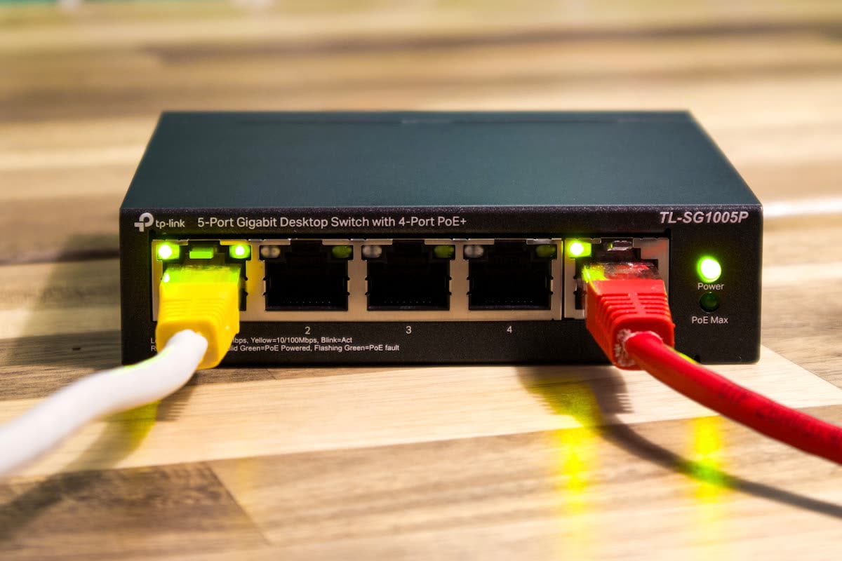 A network switch with ethernet cables connected