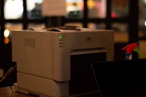 Compact printer in a dimly lit room