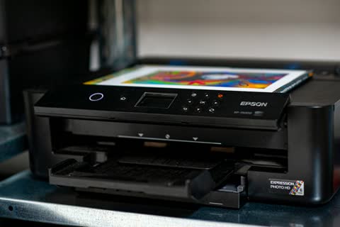 Epson inkjet photo printer with a colour print in the output tray