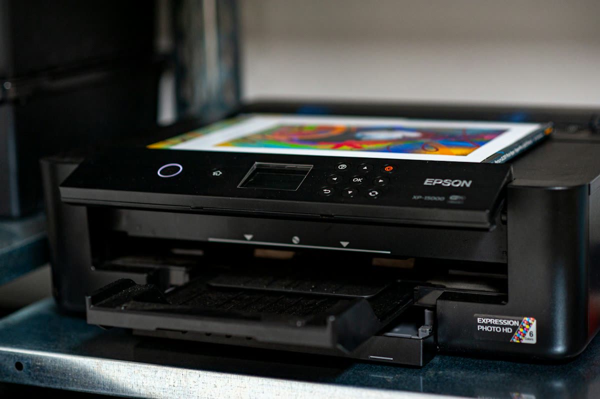 Epson inkjet photo printer with a colour print in the output tray