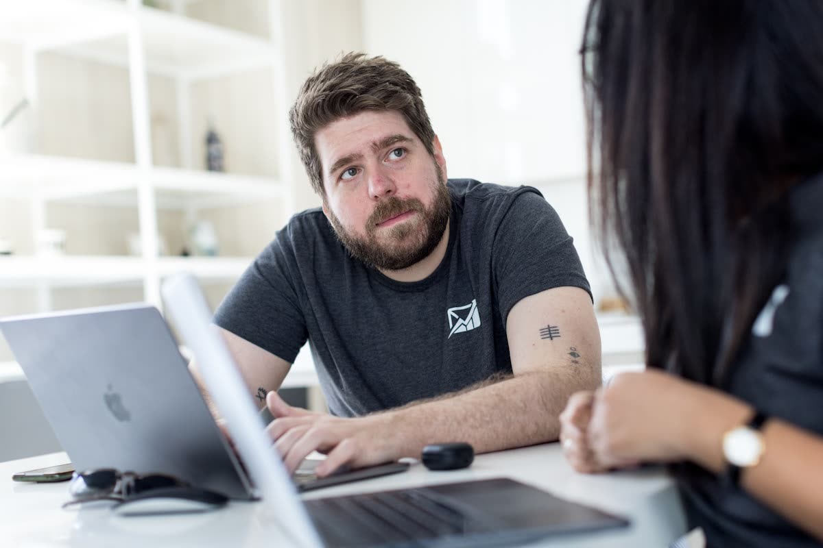 Man and woman working at a laptop together