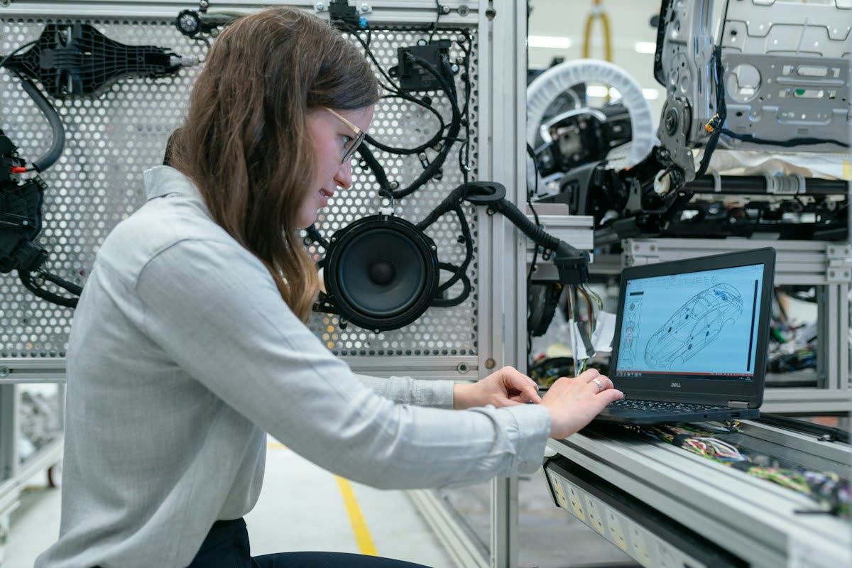 Engineer working on a laptop at a test bench