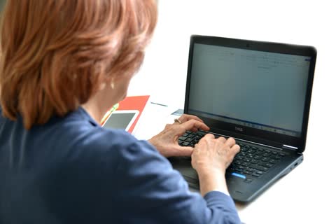 Person typing on a laptop