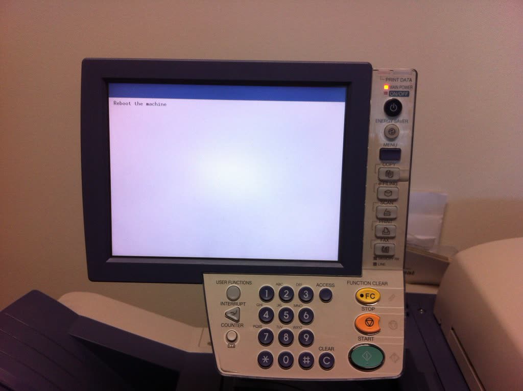 Office copier control panel with a keypad and screen