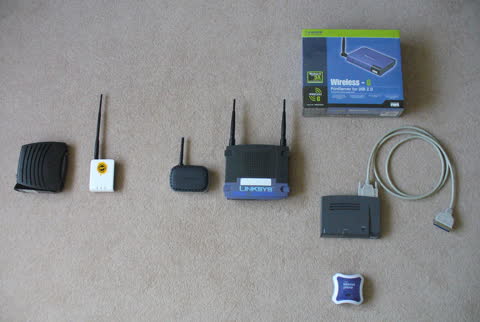 Home networking kit laid out: router, adapters and cables