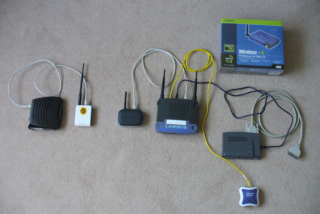 Home networking kit laid out: router, adapters and cables