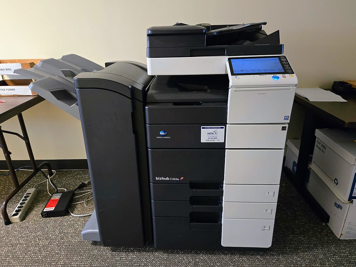 Konica Minolta Bizhub C454e photocopier in an office building